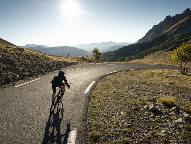 Man riding down a sunny road